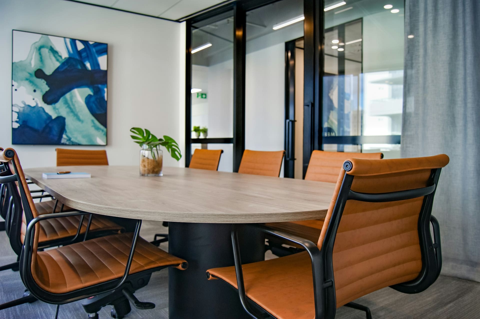 Collaboration environment: a boardroom arranged around a shared display.
