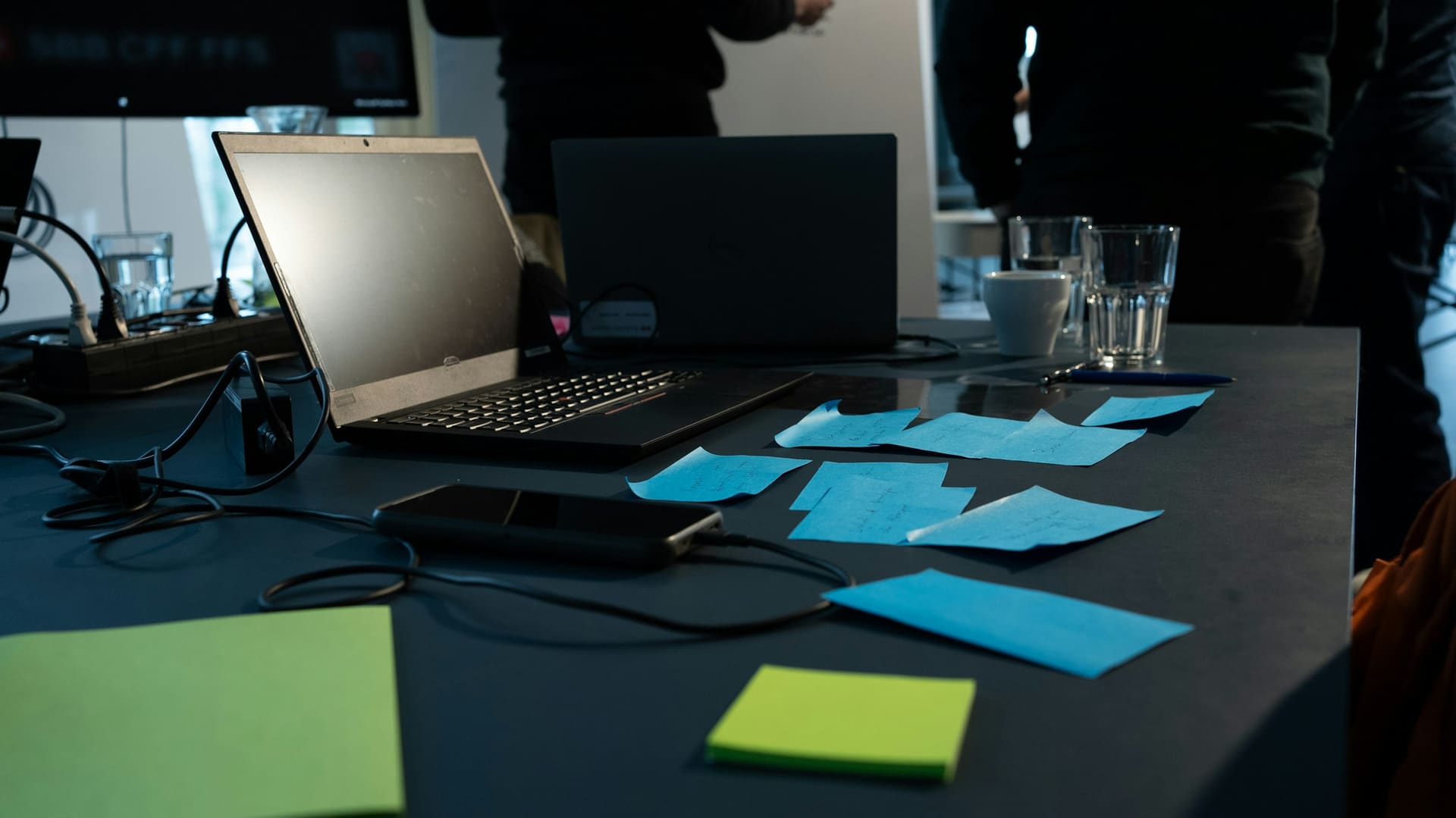 Business technology context: a corporate desk with laptop and supporting peripherals.