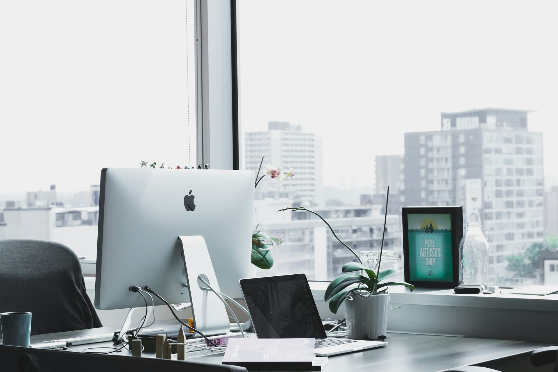 Business technology context: monitors in a commercial office environment.