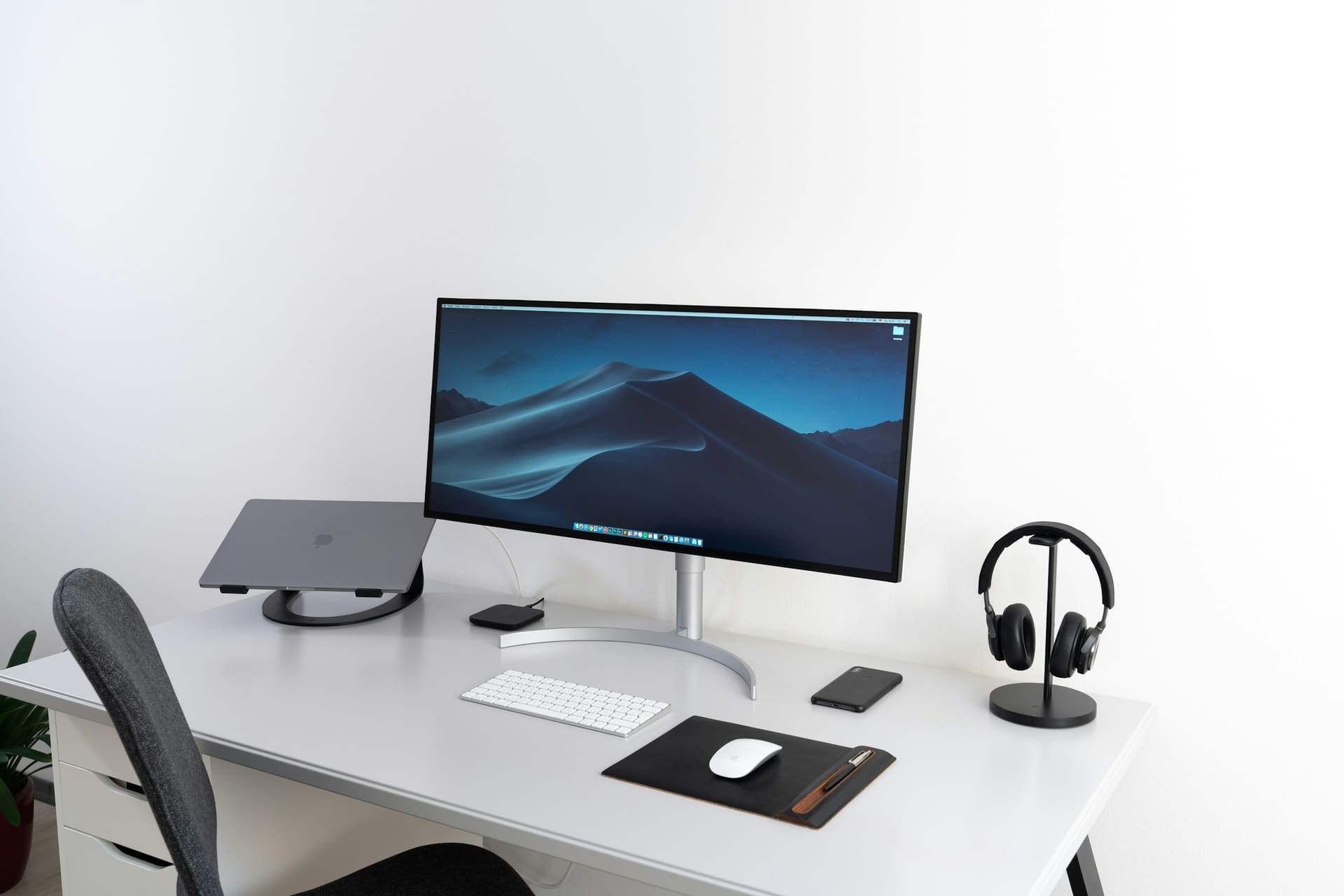Professional workstation context: a display positioned on a working desk.
