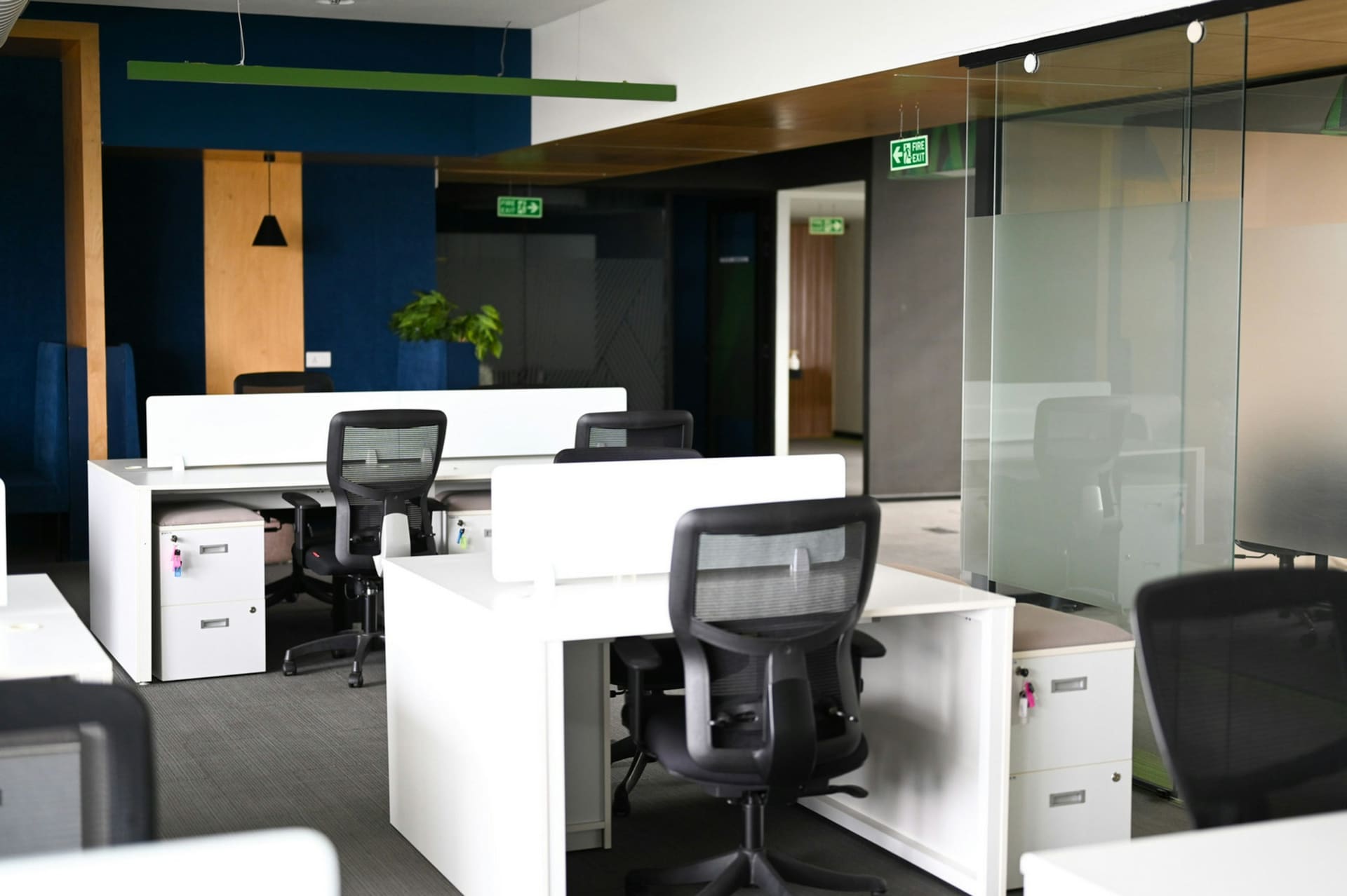 Business technology context: a modern office workstation with a desktop display and keyboard.
