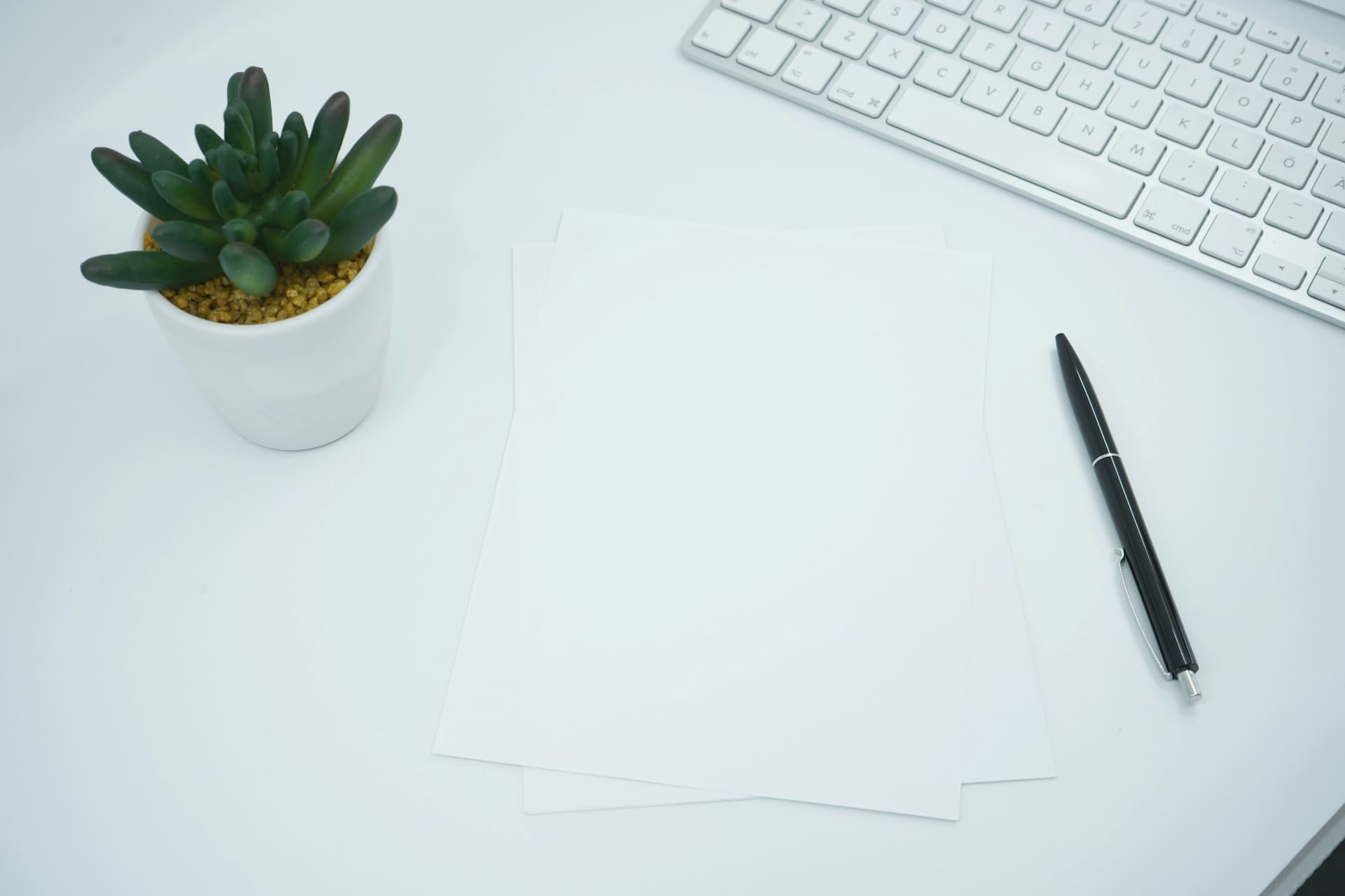 Business technology context: printed documents on an office desk.