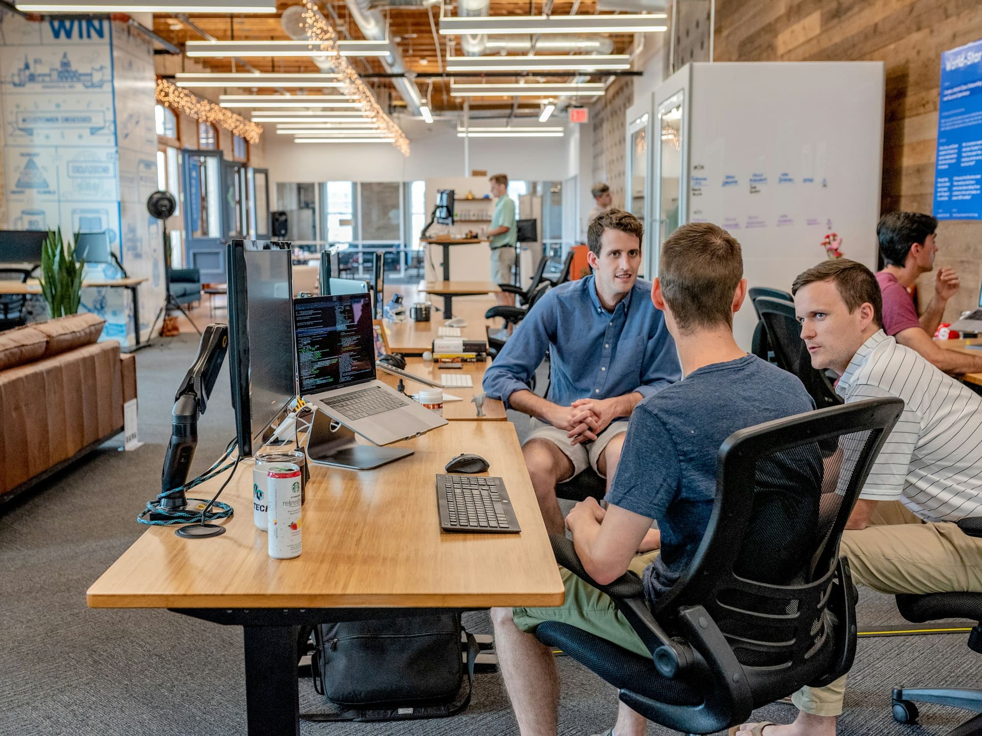 Business technology context: a team working at desks equipped with computers.