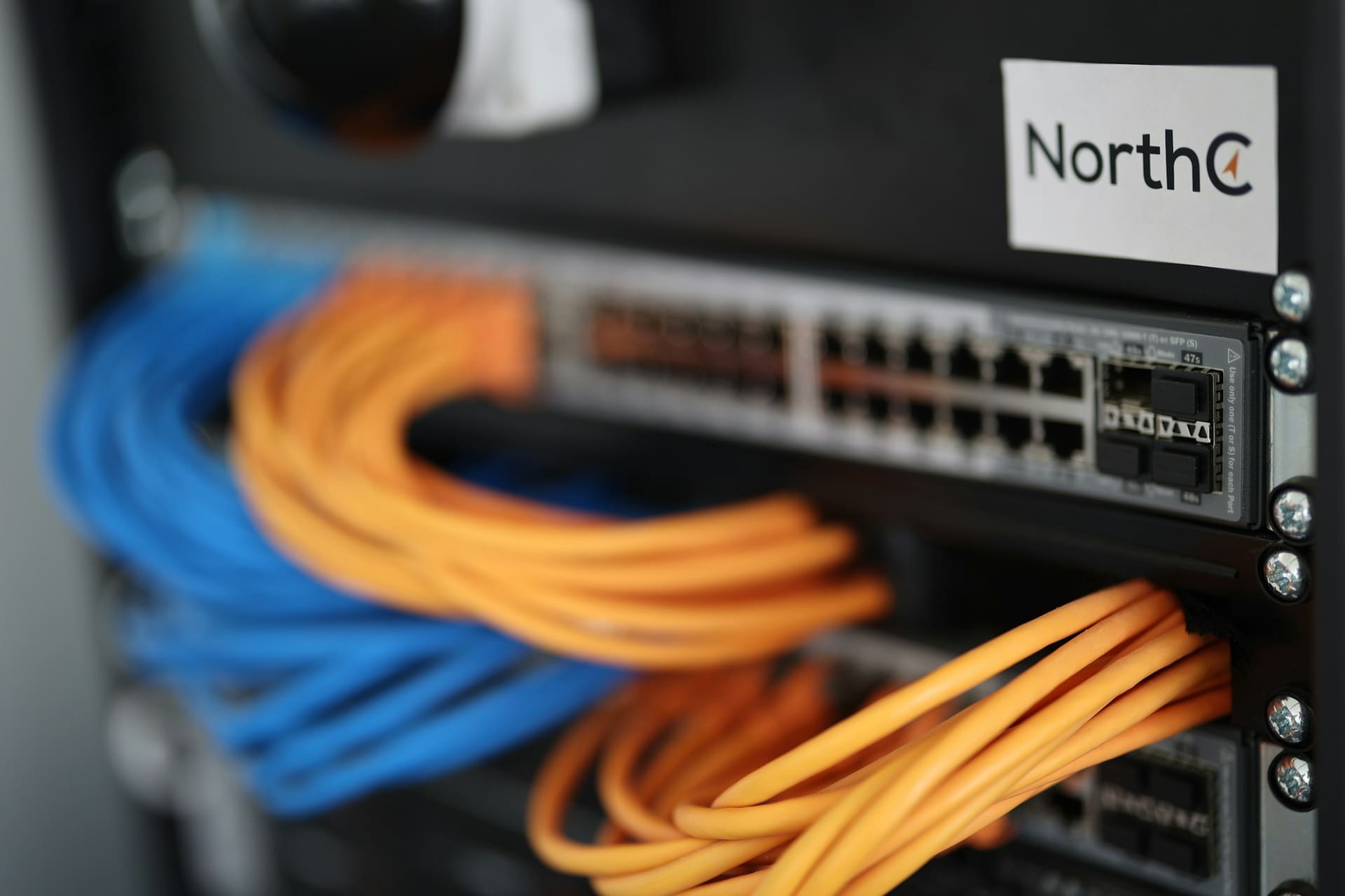 Server hardware context: structured cabling behind racked equipment.